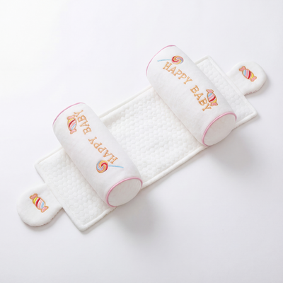 Anti-roll newborn support pillow with side cushions for stable sleeping position